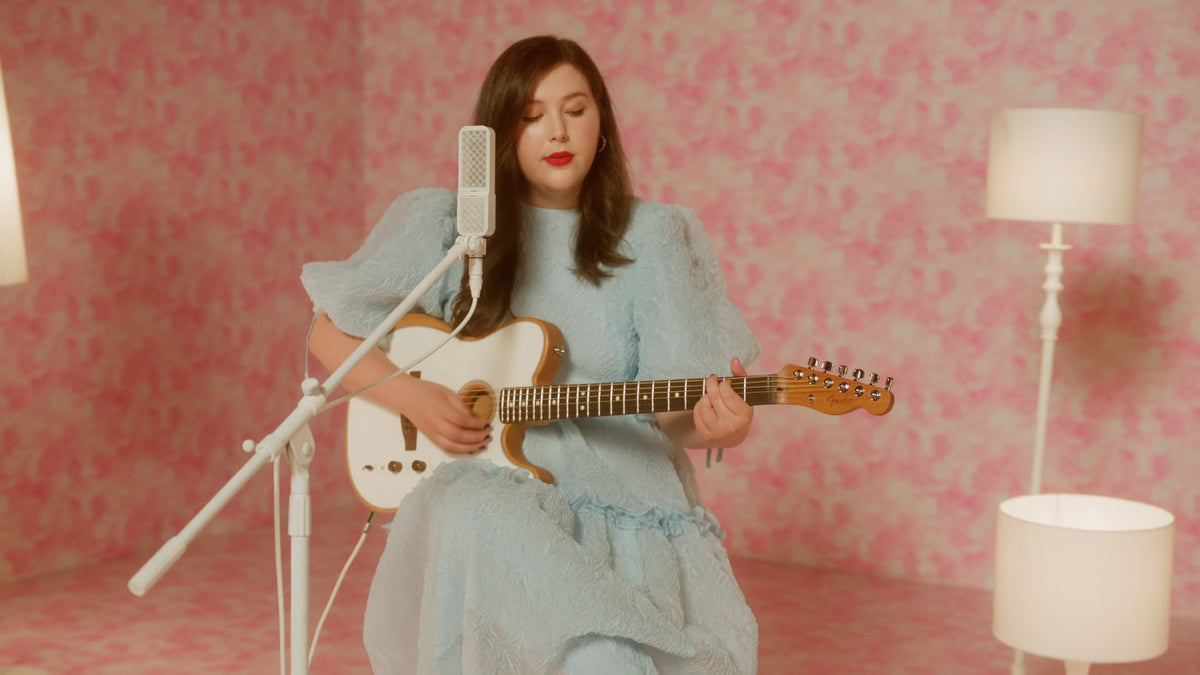 Lucy Dacus sings into an Ohma Ribbon microphone