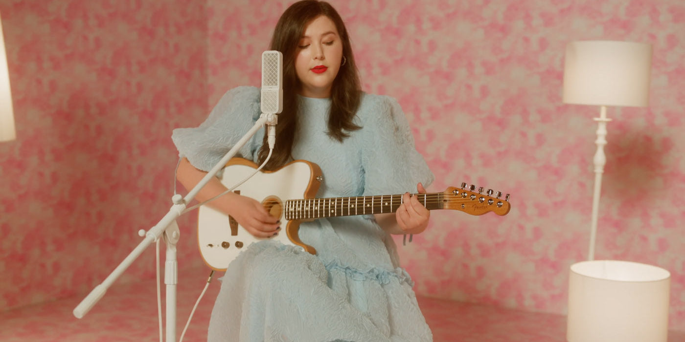 Lucy Dacus sings into an Ohma Ribbon microphone